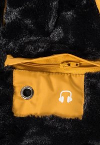 Black faux fur fabric with a yellow zippered pocket. Pocket features a silver grommet and a white headphone graphic. Soft texture, warm design.