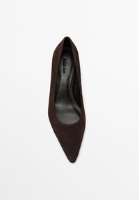 Brown suede pointed-toe high heel shoe with a smooth black interior. Features a sleek silhouette and subtle texture. No visible hardware.