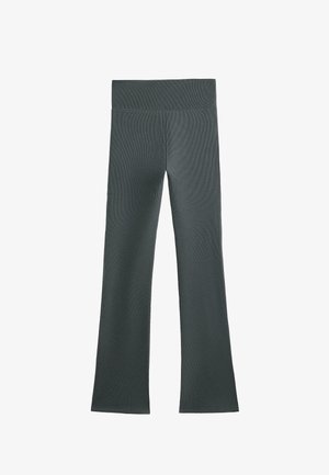 Tamnozelene rebraste tajice sa širokim pojasom i raskošnim rubom. Tkanina ima glatku teksturu i prilagođen oblik kroz celu dužinu.