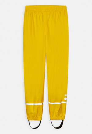 Pantalones impermeables de color amarillo brillante con cintura y puños elásticos, que cuentan con franjas reflectantes blancas y correas negras para los pies para un ajuste seguro.