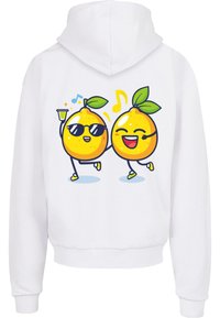 Fehér pulóver, amelyen két citrom karikatúra dizájnja látható, karokkal és lábakkal, az egyik napszemüveget visel, italként örömködve, zeneszókkal.