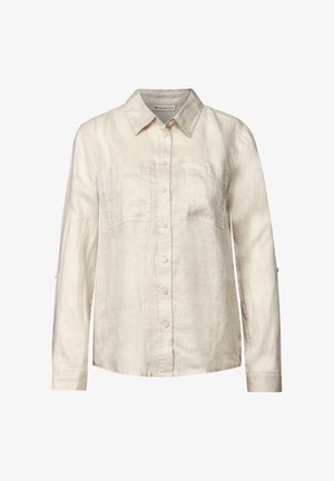 Vaaleanbeige pitkähihaisen paidan, jossa on nappikaulus, kaksi rintataskua ja käärittävät hihat, valmistettu pehmeästä, teksturoidusta kankaasta.