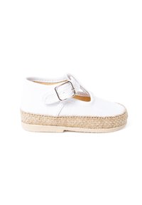 White canvas shoe with a jute-wrapped sole. Features a single strap with a silver buckle. Rounded toe design, minimalistic appearance.