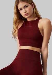 Calvin Klein Performance Reggiseno sportivo con sostegno medio - rusted root