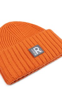 Orange knitted beanie with a ribbed texture, featuring a gray patch with a white letter "R" and a number on it.