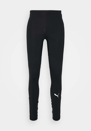 Czarne legginsy sportowe wykonane z elastycznego materiału, charakteryzujące się gładką teksturą oraz białym logo Pumy na dolnej części lewej nogawki.