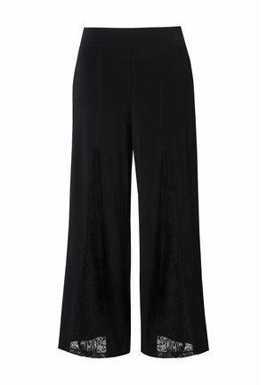 Pantalons larges noirs avec des inserts en dentelle sur les côtés. Matière douce, taille ajustée et silhouette fluide. Détails de design élégants.