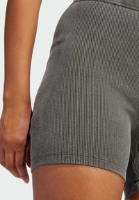 Gray ribbed shorts with a fitted shape, made from soft cotton. Features a flexible waistband and textured pattern for added detail.