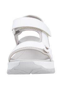 Sandale blanche à bout ouvert avec des sangles ajustables, semelle texturée et semelle rembourrée. Caractérisée par un design minimaliste et des accents gris clair.