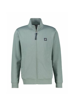 Jasnozielona bluza polarowa na zamek z wysokim kołnierzem, bocznymi kieszeniami, ściągaczami na rękawach i małą naszywką z logo na lewej piersi.