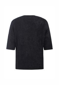 Top negro de manga corta con una superficie texturizada y pelusa, y un corte relajado. Escote simple, sin cierres visibles ni detalles adicionales.