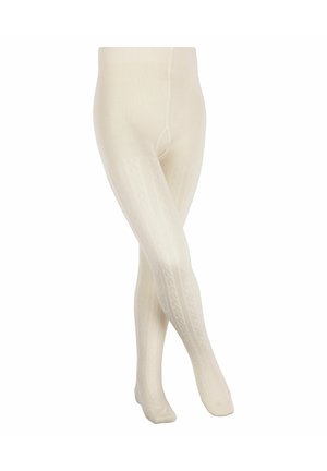 Cremefarbene, kabelgestrickte Strumpfhosen, die über gekreuzten Beinen vor weißem Hintergrund gezeigt werden.
