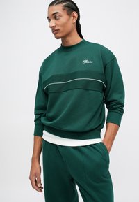 Ellesse PAULLO - Tepláky - dark green