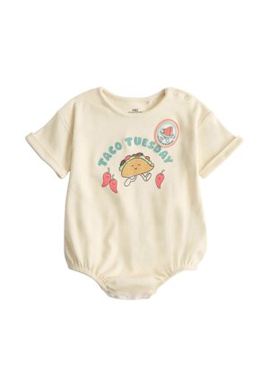 Flødefarvet babydragt med teksten "Taco Tuesday", smilende taco, to chilipebre og et lille vandmelonspatch på brystet.