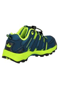 Blue and neon green athletic shoe with a textured upper, elastic laces, and a rubber sole featuring traction spikes for grip.
