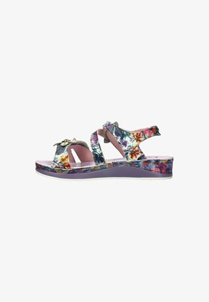 Sandale pour femme à bout ouvert avec des brides florales multicolores, semelle rembourrée violette, fermetures réglables à Velcro et ornement métallique en forme de fleur.