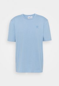 Light blue short-sleeve Adidas t-shirt with crew neck and small tonal Adidas Trefoil logo on the left chest.