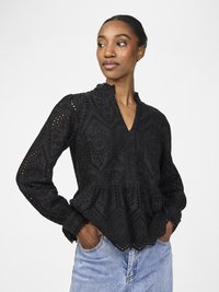 Black blouse with a textured embroidered design, peplum shape, and a scalloped hem. Features long sleeves and a stand collar.