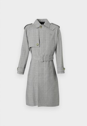 Grijs geruit trenchcoat met een gebeltste taille, knopen details op de manchetten en een brede kraag. Heeft een cropped overlay op één schouder.