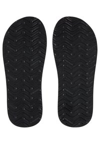 Sorte gummisåler til sko med tekstureret zigzag mønster, der giver greb og polstring. Flad design, der er egnet til forskellige skostile.