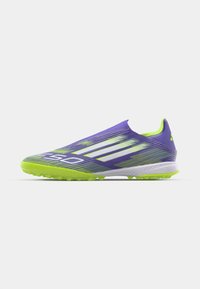 Lightweight, purple synthetic soccer shoe with yellow-green accents, a slip-on design, textured upper, and rubberized studded sole.