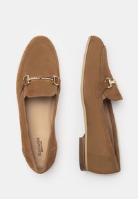 Brown suede loafers with a gold chain accent, almond-shaped toe, flat heel, and smooth interior lining. Flat sole with stitching details.
