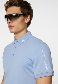 J.LINDEBERG Sports TOUR - Pikeepaita - rain washed