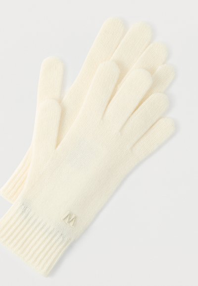 Γάντια σε εκρού απόχρωση φτιαγμένα από απαλό υλικό με ριμπ μανσέτα και μικρό κεντημένο λογότυπο στη μανσέτα. Σχεδιασμός με πέντε δάχτυλα.