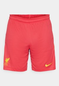 Punased spordilühikesed püksid tekstuursed, elastne vöökoht, kollane Nike swoosh ja Liverpool FC kollane logo.