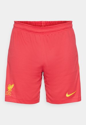 Pantaloni sportivi rossi con tessuto testurizzato, vita elasticizzata, logo giallo Nike e logo del Liverpool FC in giallo.