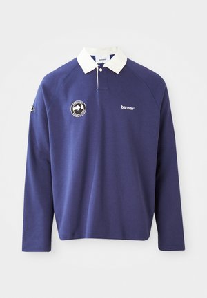 Tumesinise pika varrukaga polo särk valge kraega, millel on vasakul rinnal ümmargune logo ja tikitud "bareen" tekst. Pehme materjal.