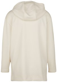 Kermanvärinen huppari, pehmeä rakenne, rento malli, pitkät hihat, jossa pyöreä helma ja hienovarainen sauman yksityiskohta olkapäillä.