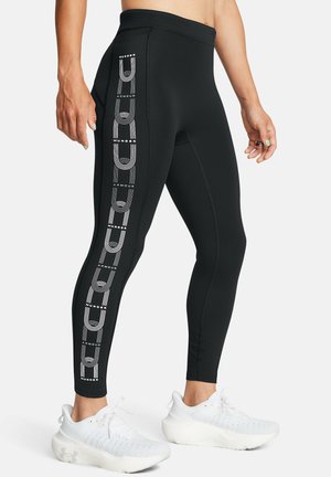 Leggings neri realizzati in tessuto elasticizzato, con lettere e linee bianche sui lati, progettati per l'abbigliamento sportivo.