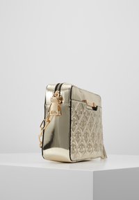 River Island Bandolera - gold-coloured