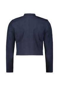 Marinblå kort jacka i mjuk mocka med långa ärmar, Mandarin-krage och en slät yta. Har skräddarsydda sömmar på baksidan.