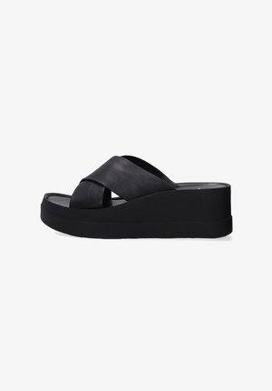 Zwarte plateau sandalen met een kruislings bandontwerp van leer. Bevat een dikke zool voor extra hoogte en stabiliteit.