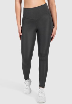 Leggings taille haute, gris charbon, en tissu extensible et lisse avec un design ajusté ; comprenant des poches latérales et des coutures plates.