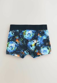 Pojkars boxershorts i marinblått tyg med färgglada splattermönster och fotbollsdesign; elastisk midja med kontrasterande mörk kant.