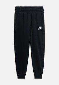 Pantalons de survêtement noirs Nike avec ceinture élastique, poches latérales, poignets côtelés et logo Nike blanc sur la cuisse gauche.