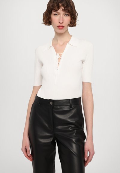 STUDIO ID DANA  - Leather trousers - black