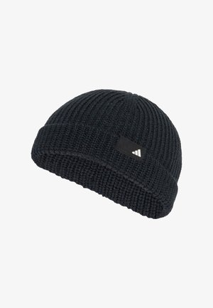 Knitted black beanie with a ribbed texture, folded cuff, and a rectangular black patch featuring white branding.