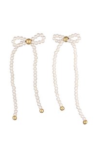 Clip de cheveux en perles blanches avec des accents en boule dorée, présentant un design en nœud et deux brins s'étendant du centre.