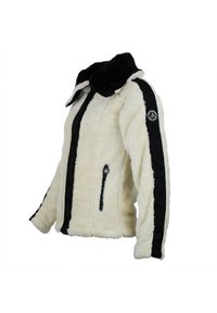 Veste en fausse fourrure blanche avec des accents noirs, fermeture éclair à l'avant, deux poches latérales et un col haut. Présente un logo sur la manche.