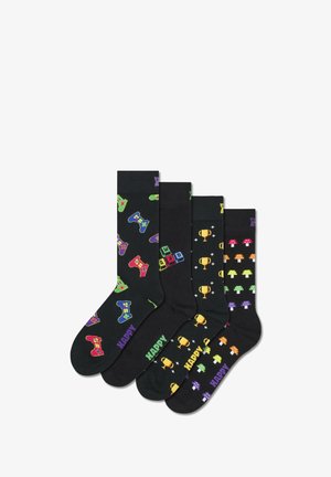 Set of four black socks featuring colorful gaming controllers, trophies, and mushrooms in vibrant patterns. Made of soft, stretchable material.