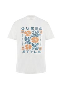 Witte katoenen t-shirt met een kleurrijke grafische print van bloemmotieven en de tekst "GUESS". Korte mouwen en een ronde hals.