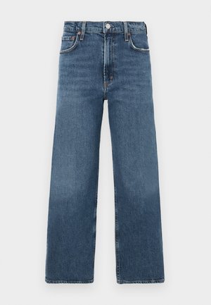 Blue denim jeans with a high waist, wide leg cut, subtle faded areas, and classic button closure. Features standard five-pocket design.