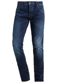 Slim-fit denimjeans i mörkblått. Har klassisk femficksdesign med dragkedja, lätt blekning och intrikata sömnadsdetaljer.