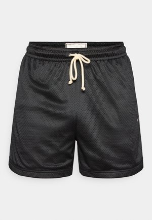 Melni režģa šorti ar auklu viduklī kontrastējošā gaišā krāsā. Ir sānu šuves un neliels logo apakšējā priekšpusē.