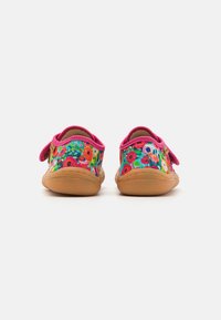 Colorful floral-patterned shoes with pink accents, featuring a velcro strap and a tan rubber sole, designed for comfort.