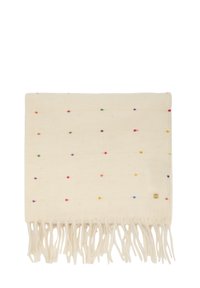 Sciarpa tessuta color crema con piccoli puntini multicolori, estremità frangiate e una piccola targhetta quadrata dorata in un angolo.
